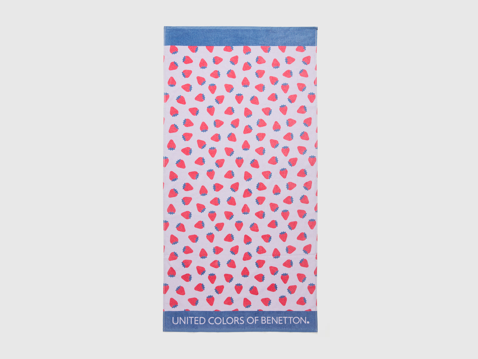Telo mare con pattern fragole da bambino lilla | Benetton Outlet