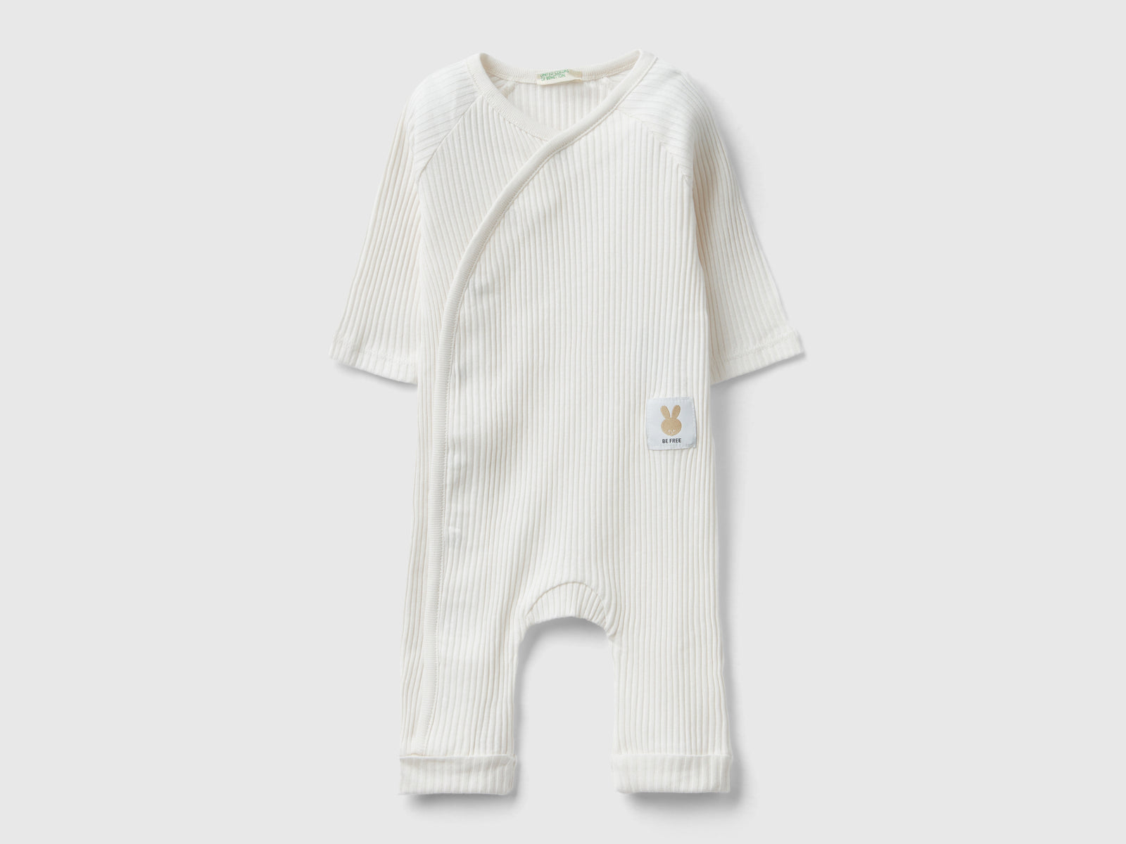 Tutina a costine in cotone bio da neonato bianco panna | Benetton Outlet