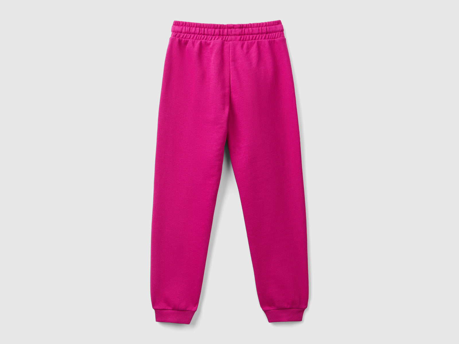 Pantaloni in felpa con logo da bambina fucsia 2 | Benetton Outlet