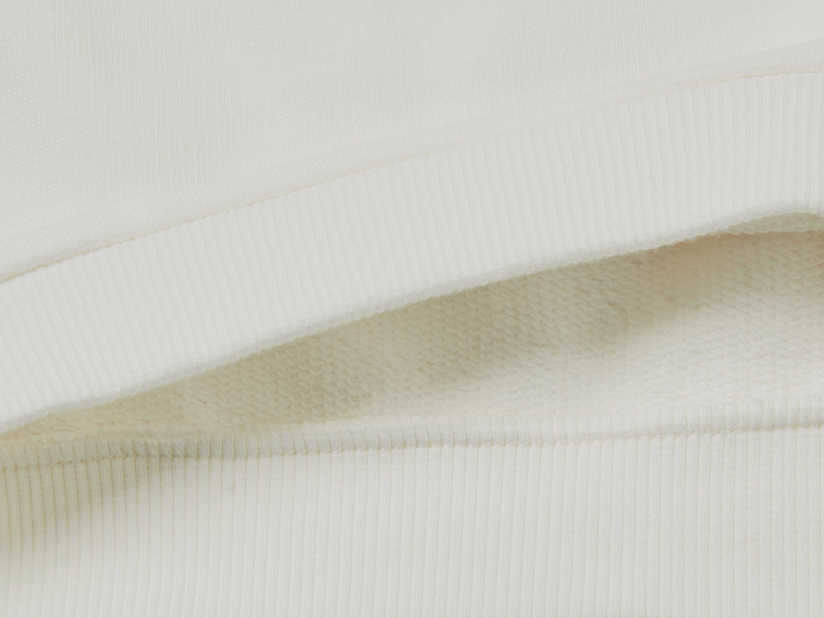 Felpa in cotone bio con stampa glitter