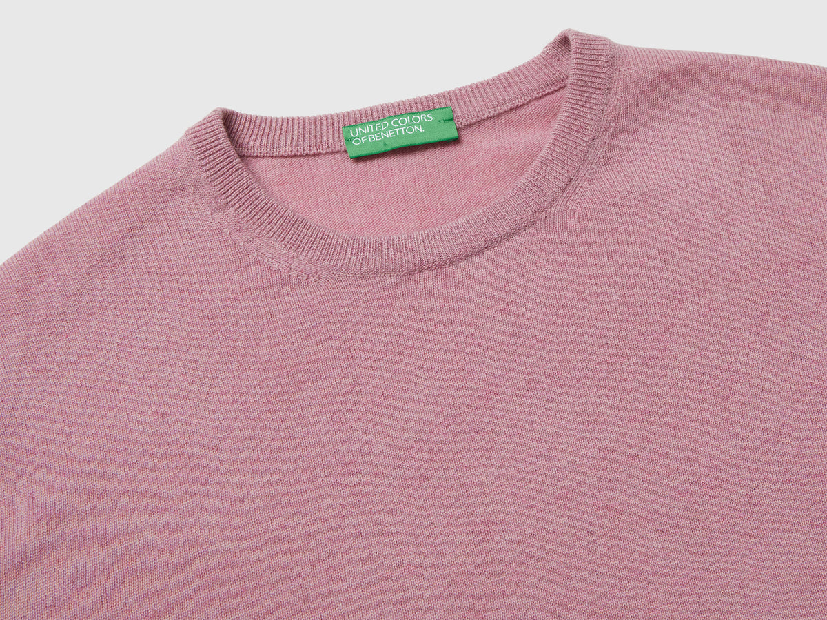 Maglia girocollo rosa mélange in pura lana Merino