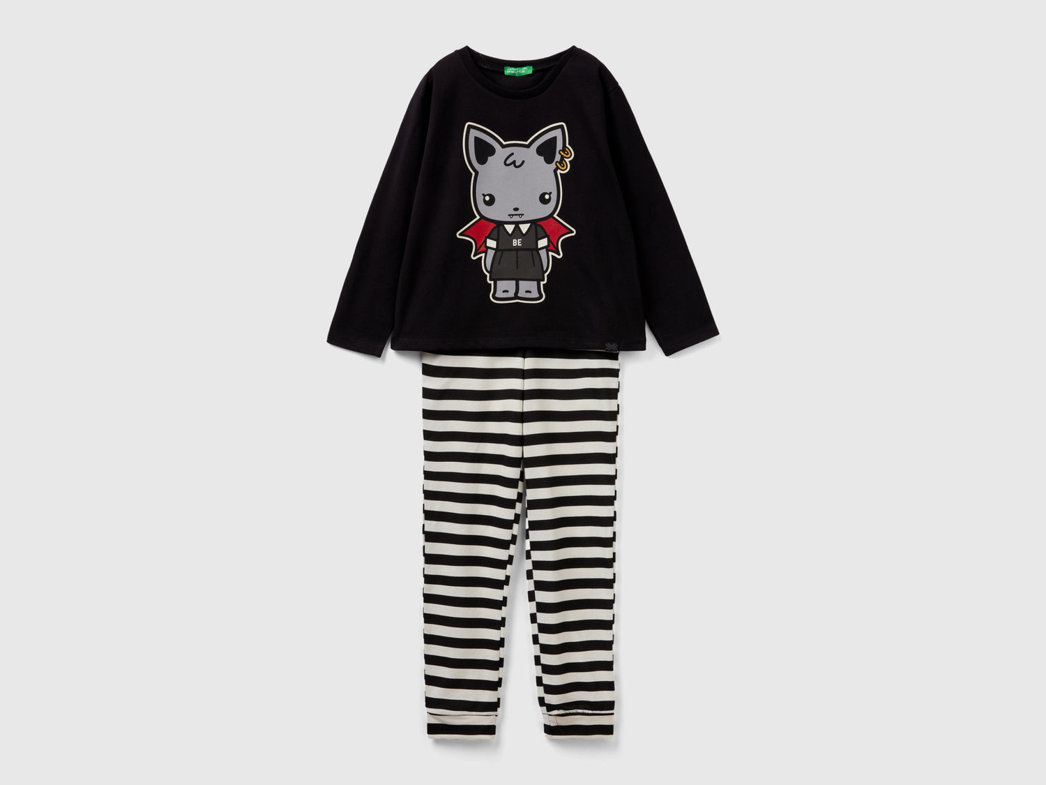 Pigiama con stampa mascotte luminescente da bambina nero | Benetton Outlet