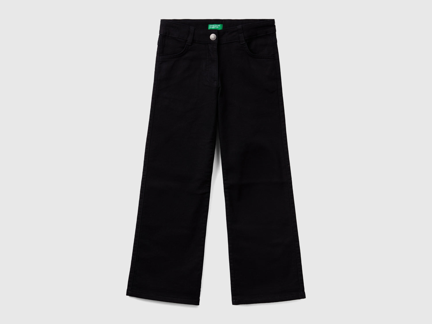 Pantaloni a zampa stretch da bambina nero | Benetton Outlet