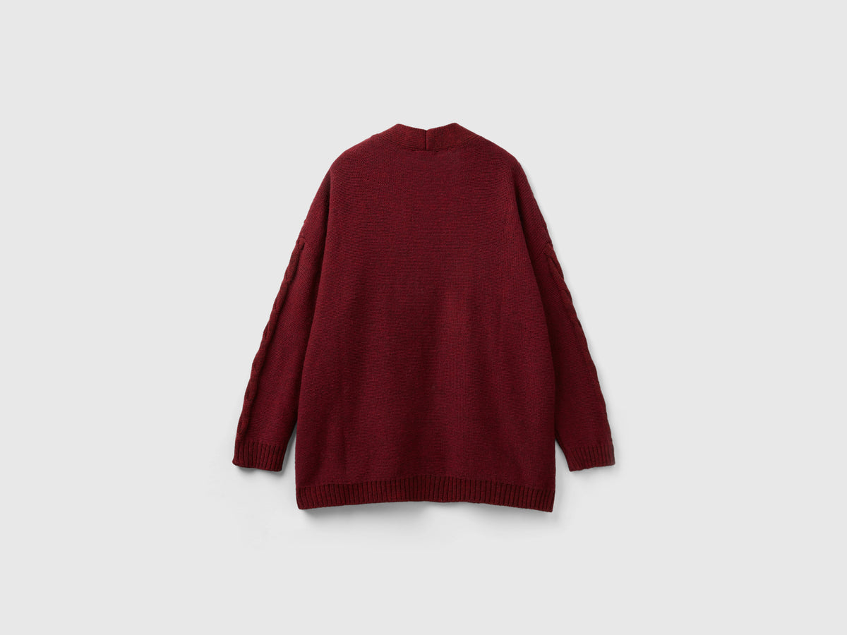 Cardigan con trecce e losanghe