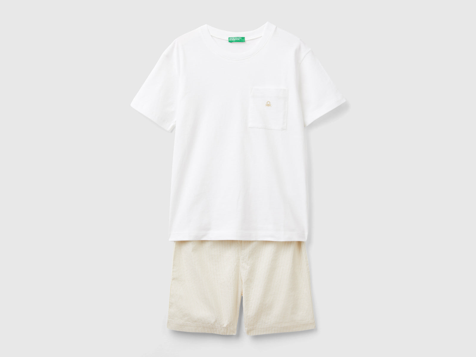 Pigiama con shorts a righe da bambino bianco | Benetton Outlet
