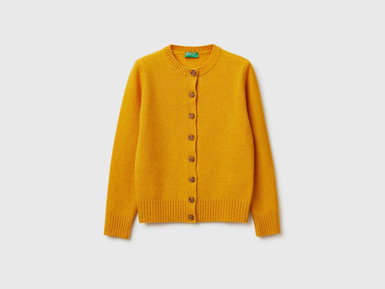 Cardigan in pura lana Shetland da donna senape | Benetton Outlet
