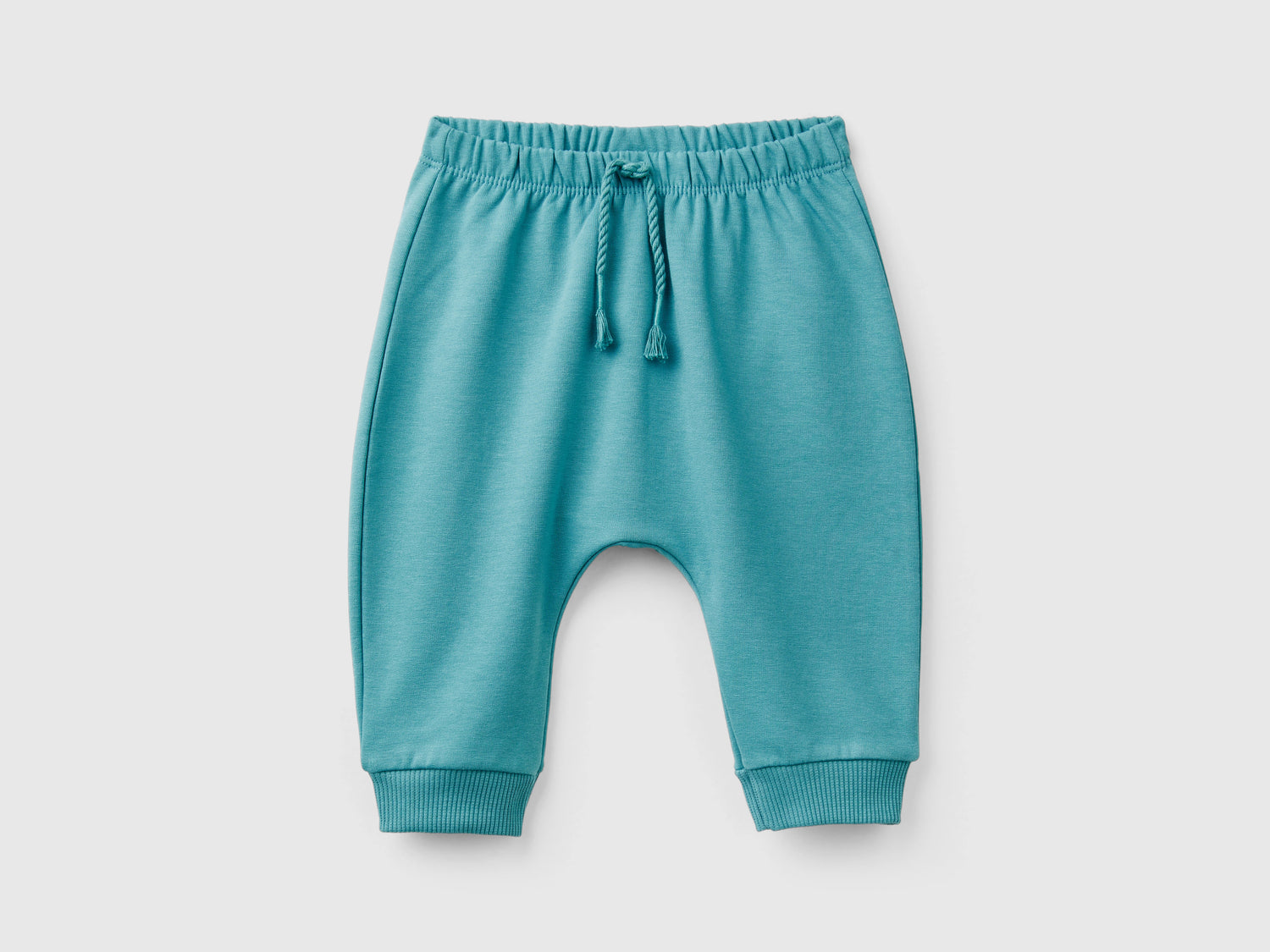 Pantaloni in calda felpa con taschino da neonato verde ottanio | Benetton Outlet
