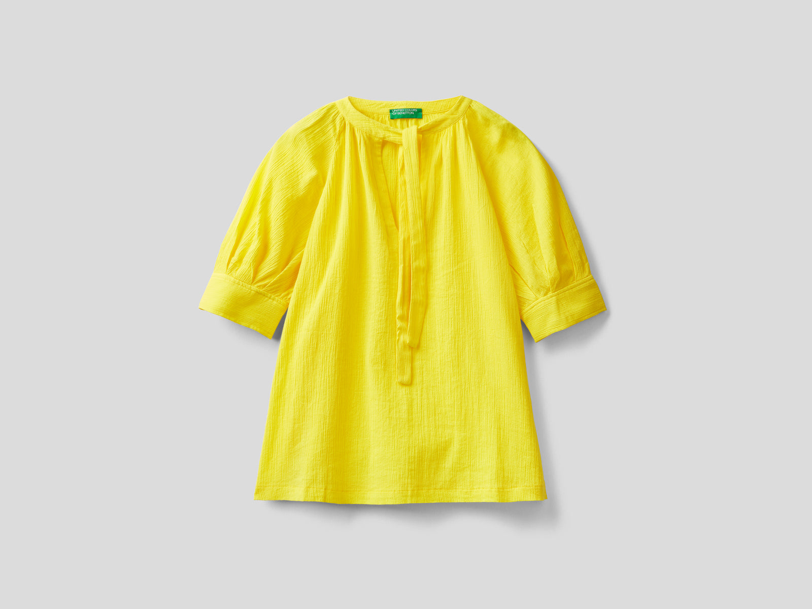 Blusa con fiocco al collo da donna giallo | Benetton Outlet