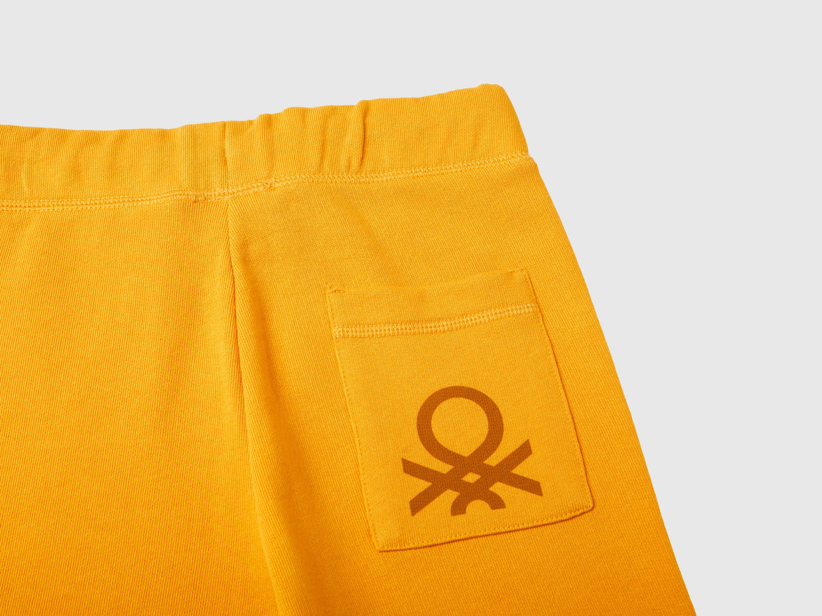 Pantaloni in felpa 100% cotone da bambino senape 3 | Benetton Outlet