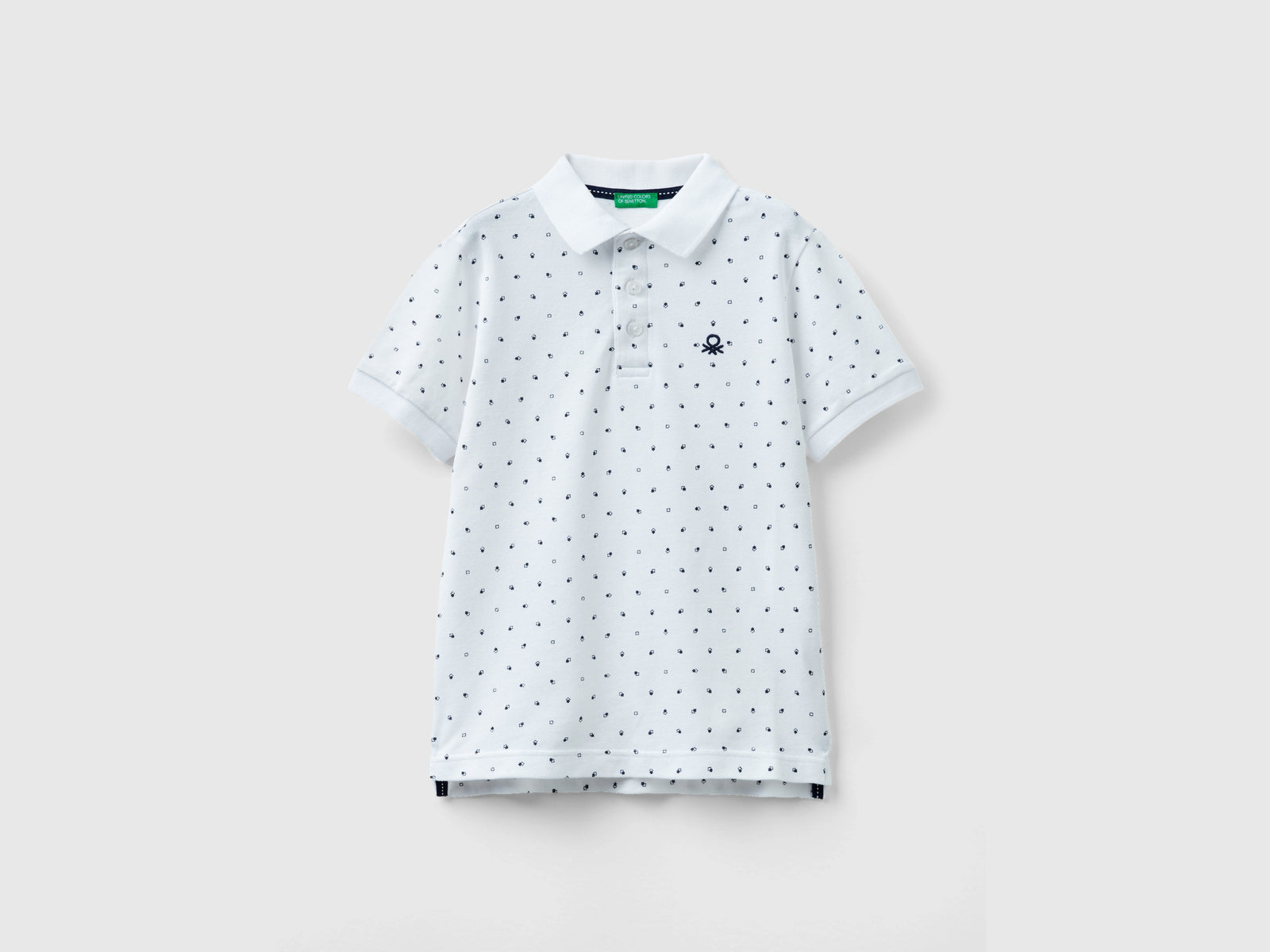 Polo micro fantasia slim fit da bambino bianco | Benetton Outlet