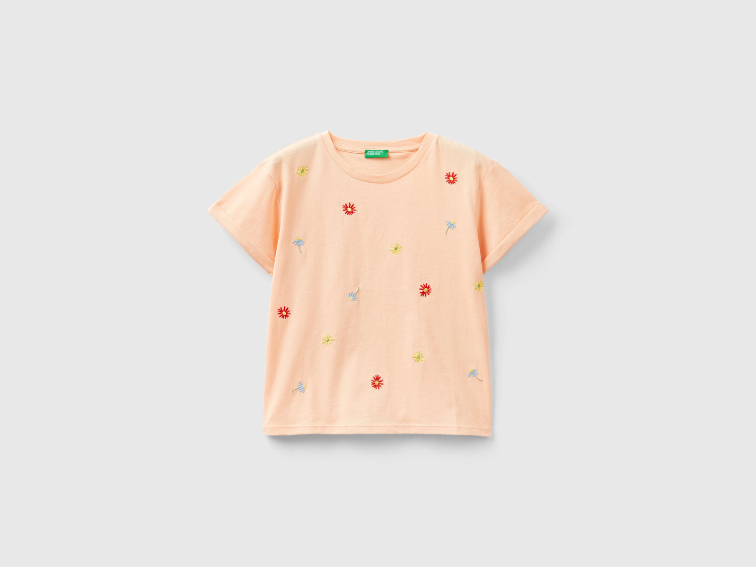 Maglietta con fiori ricamati da bambina pesca | Benetton Outlet