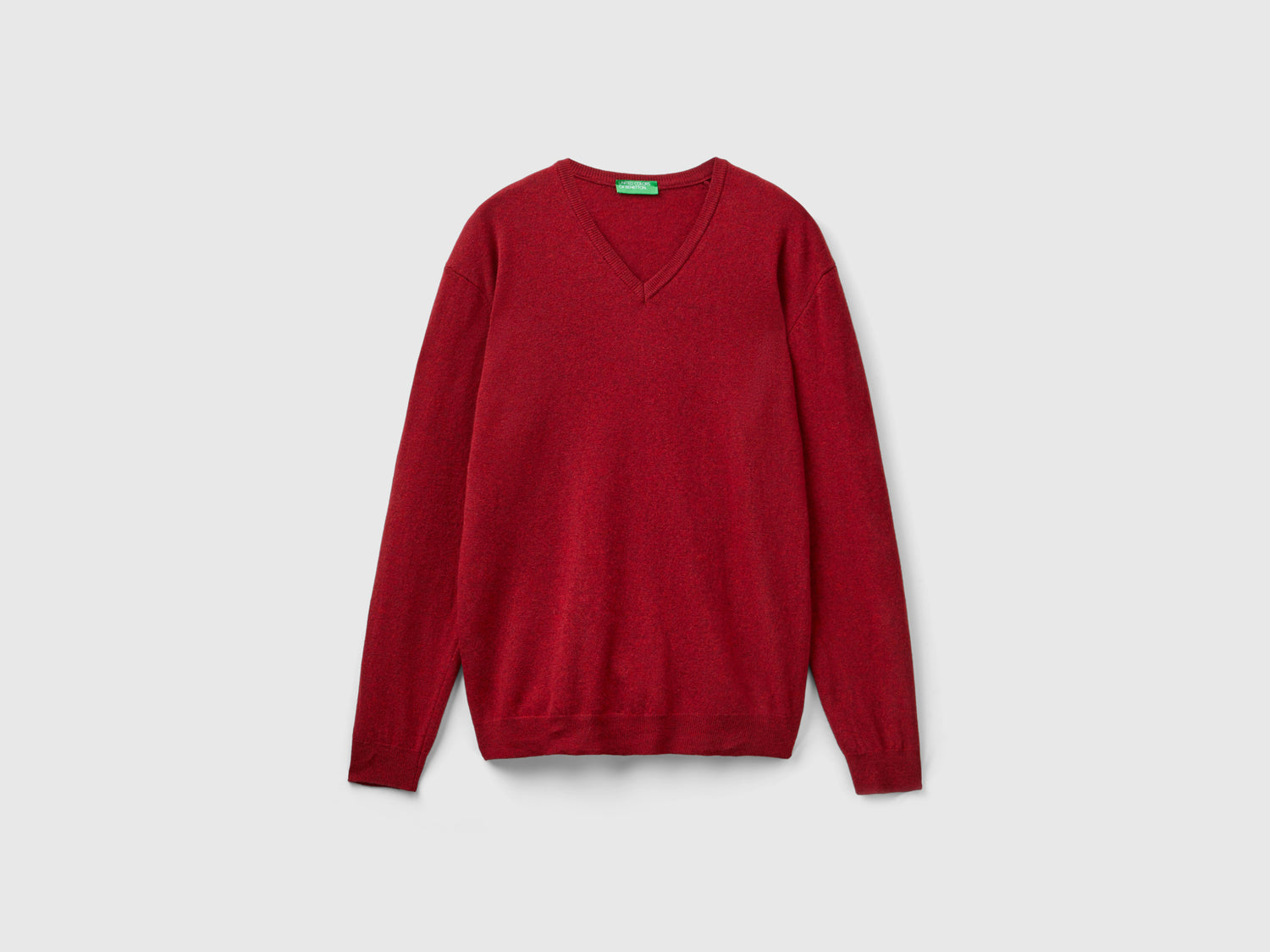 Maglia scollo a V mélange in pura lana Merino da uomo rosso | Benetton Outlet