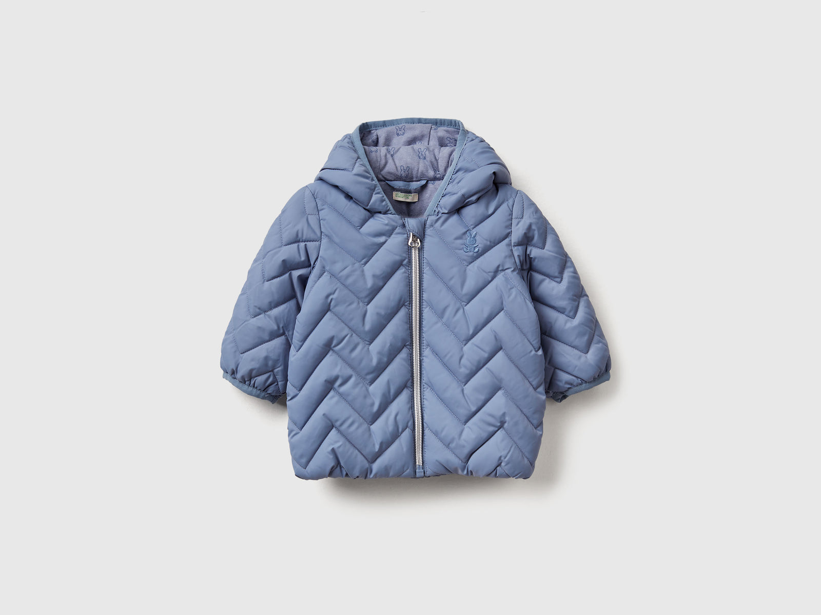 Piumino imbottito con orecchie da neonato celeste | Benetton Outlet