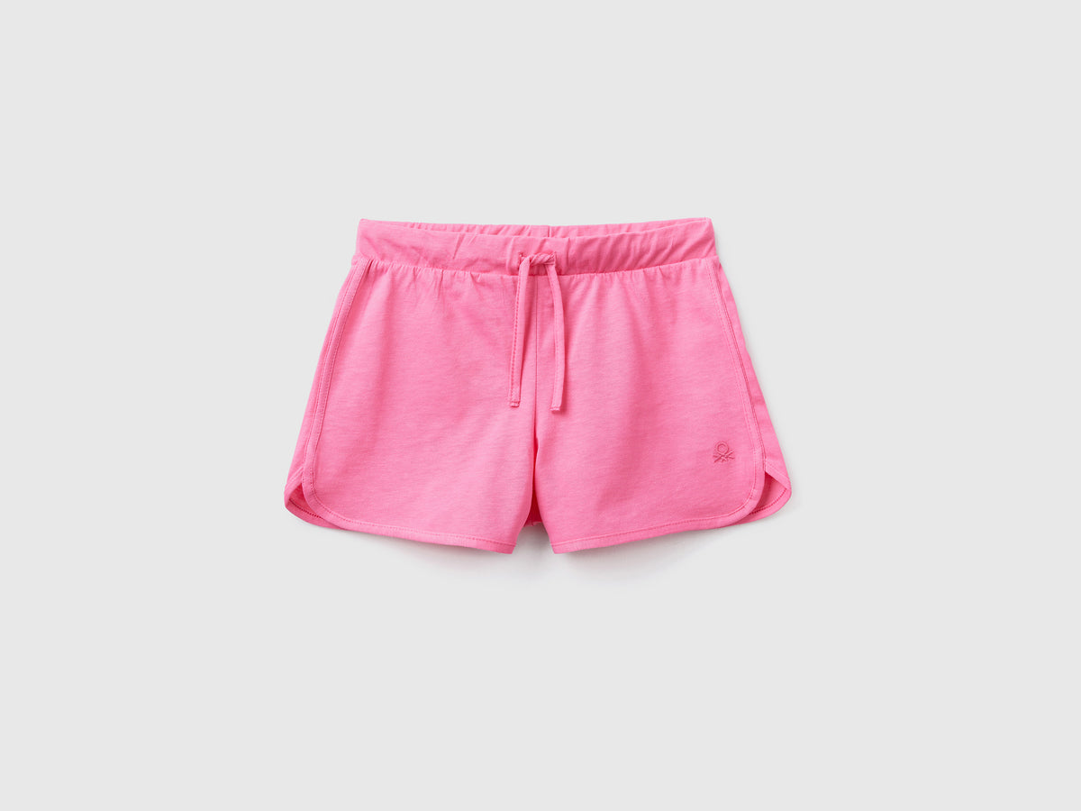 Pantaloni corti sportivi in puro cotone da bambina rosa | Benetton Outlet