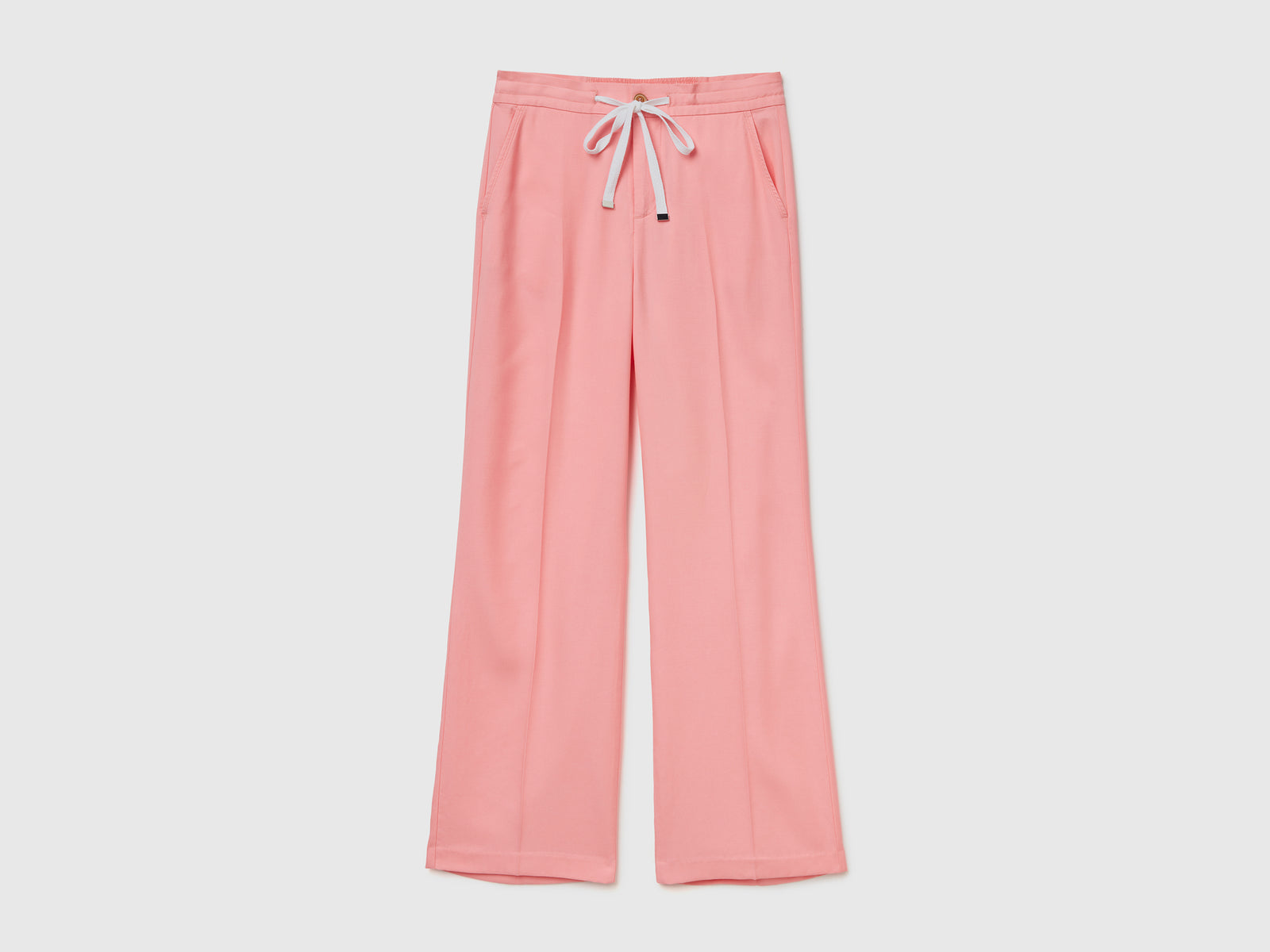 Pantaloni lunghi in lyocell fluido e leggero da donna rosa | Benetton Outlet