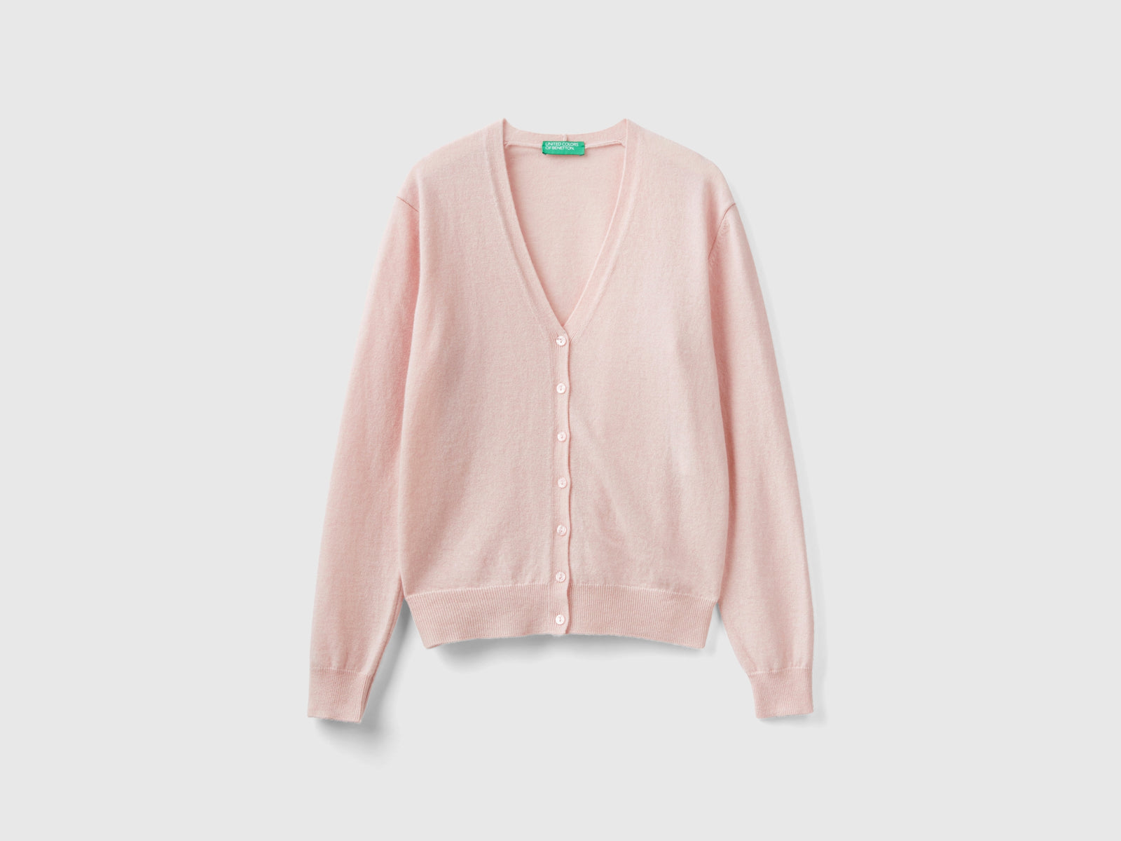 Cardigan scollo a V in pura lana Merino da donna rosa pastello | Benetton Outlet