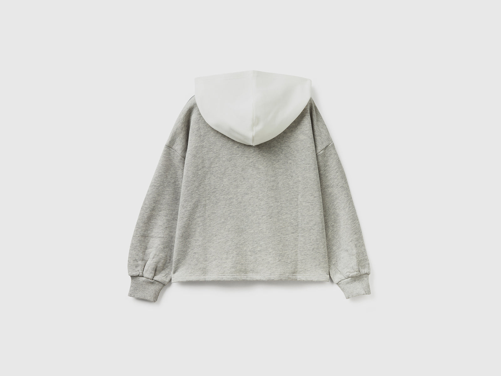 Felpa over fit con cappuccio da bambina bianco panna 2 | Benetton Outlet