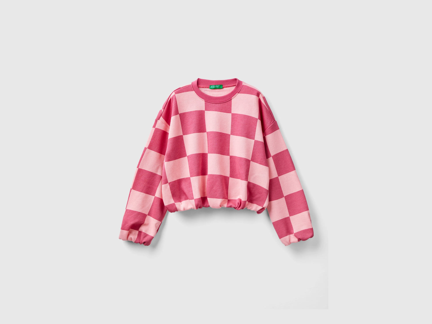 Felpa a scacchi boxy fit da bambina rosa | Benetton Outlet
