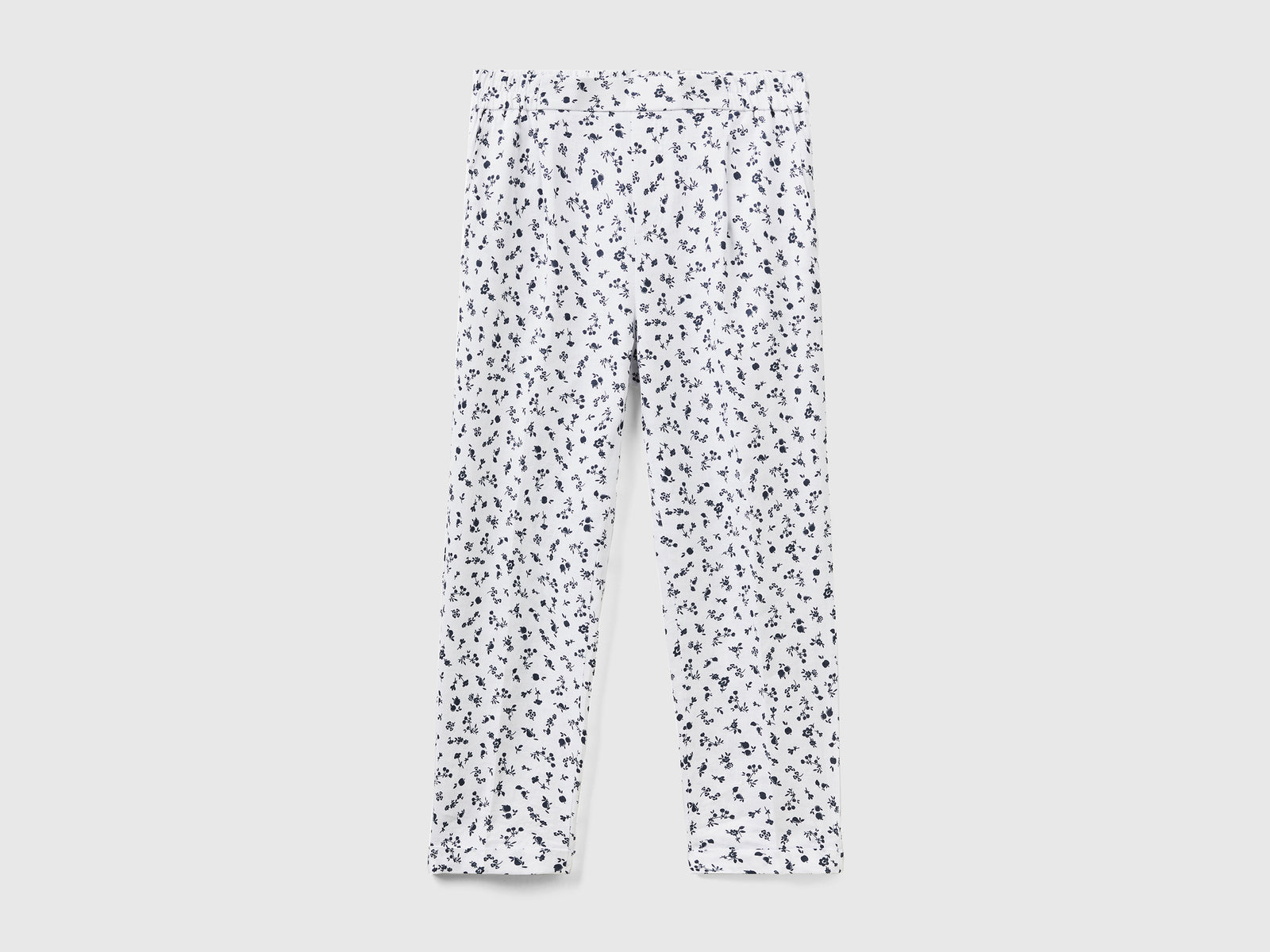 Pantaloni lunghi con stampa fantasia da donna bianco | Benetton Outlet