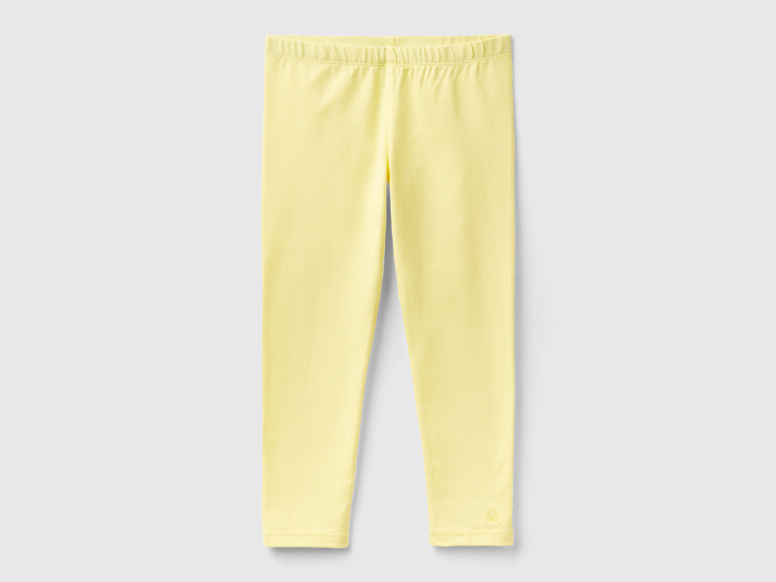 Leggings in cotone stretch da bimba giallo | Benetton Outlet