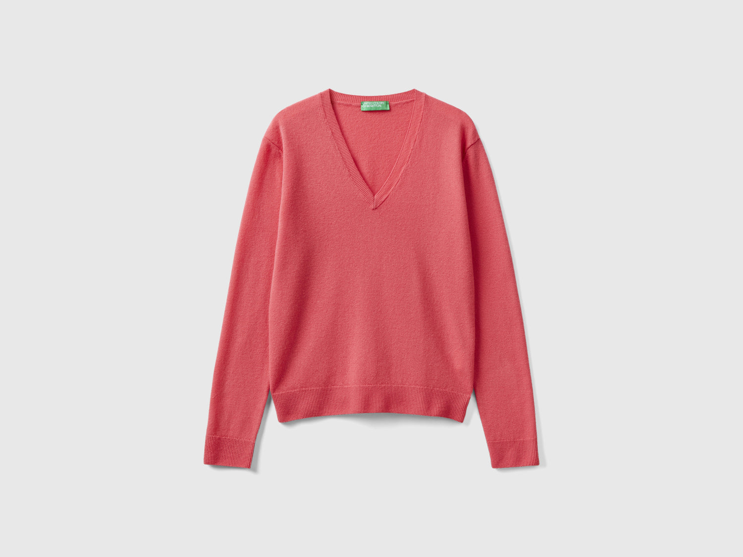 Maglia con scollo a V rosso in pura lana Merino da donna fragola | Benetton Outlet