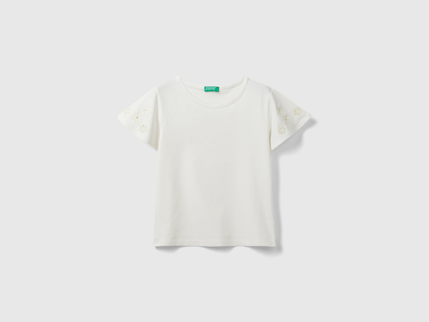 T-shirt con ricami floreali da bambina bianco panna | Benetton Outlet