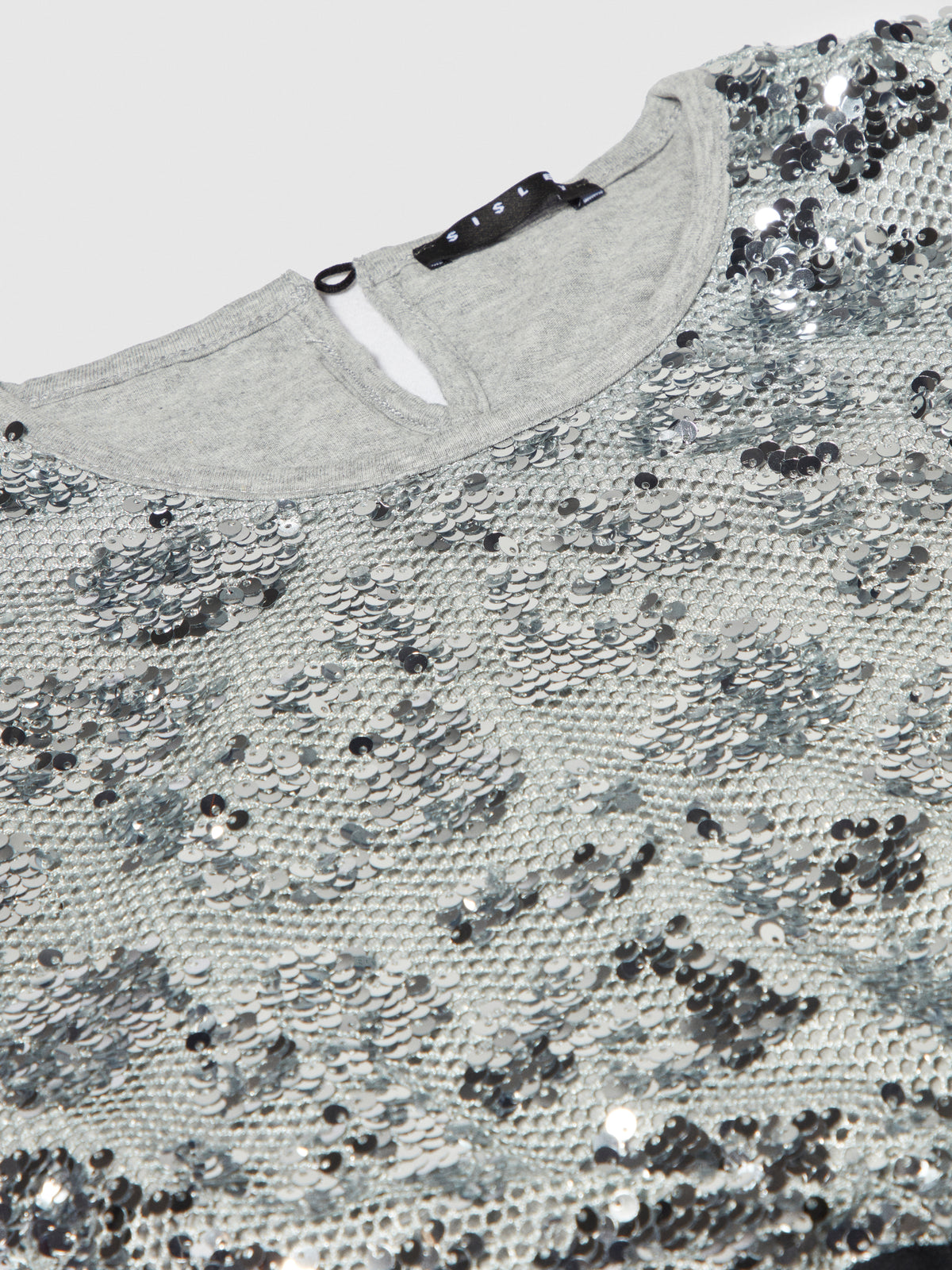 Blusa in rete e paillettes
