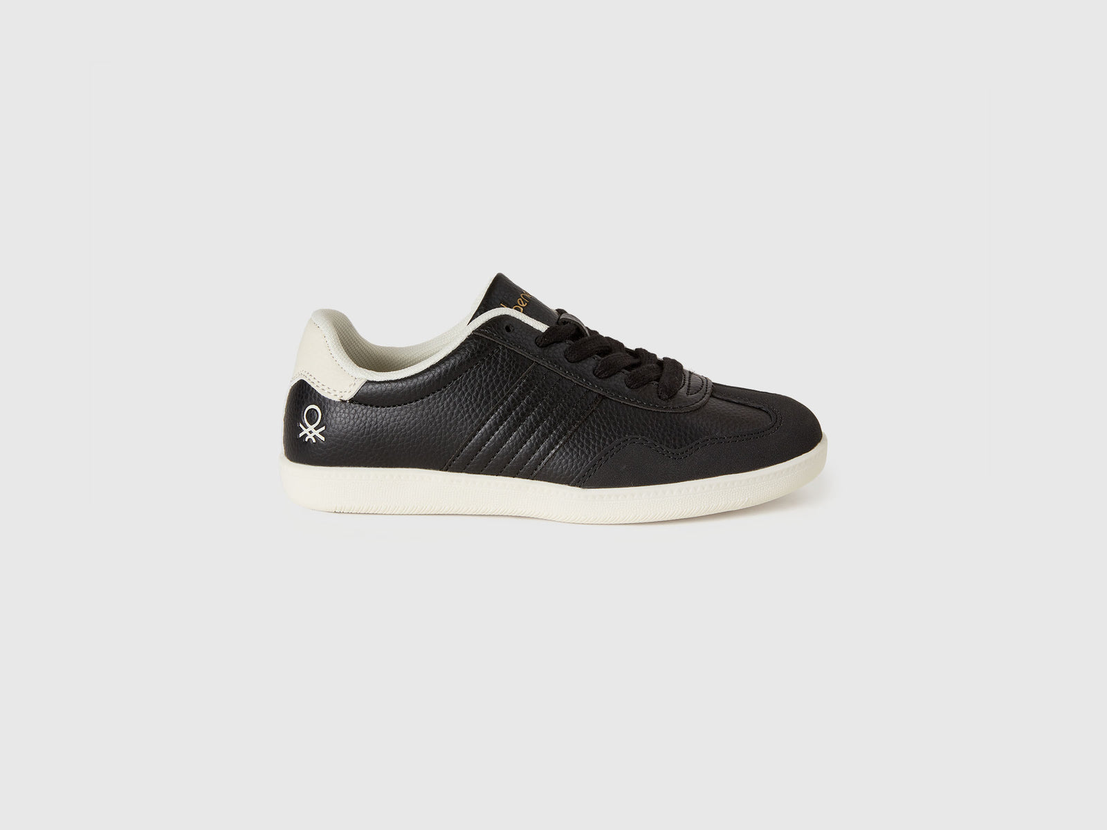 Sneakers in tessuto spalmato e scamosciato da bambino nero | Benetton Outlet
