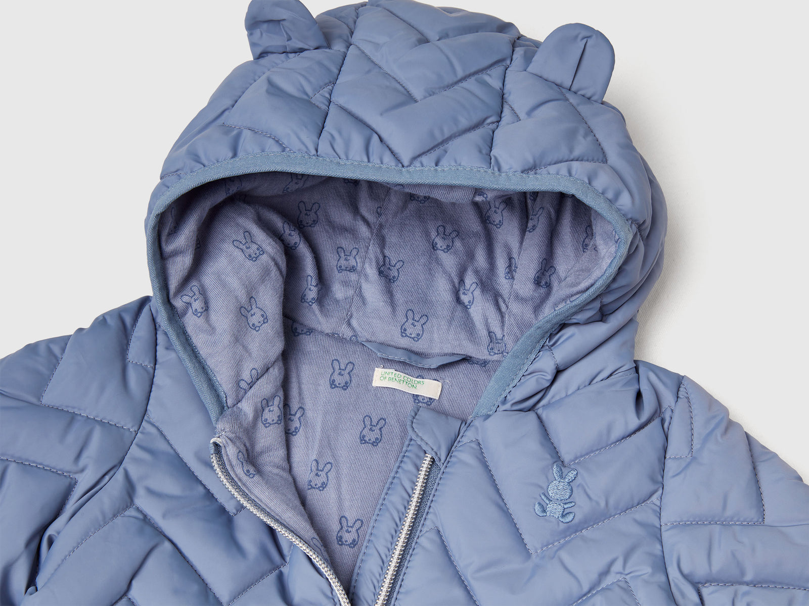 Piumino imbottito con orecchie da neonato celeste 3 | Benetton Outlet
