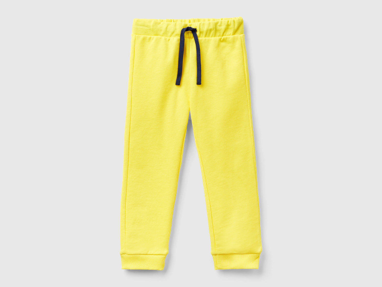 Pantaloni in felpa con taschino da bimbo giallo | Benetton Outlet