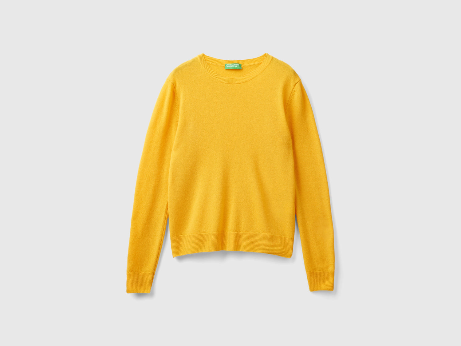 Maglia girocollo giallo ocra in pura lana Merino da donna senape | Benetton Outlet