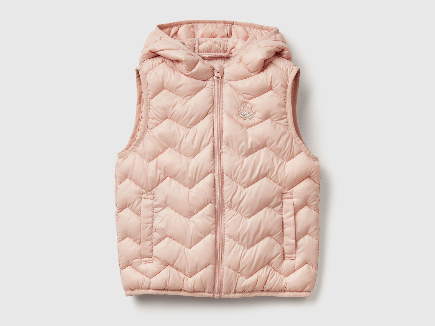 Gilet imbottito con cappuccio da bimba rosa tenue | Benetton Outlet
