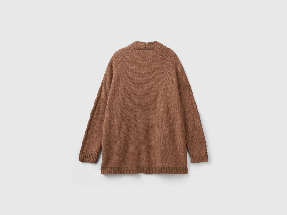 Cardigan con trecce e losanghe