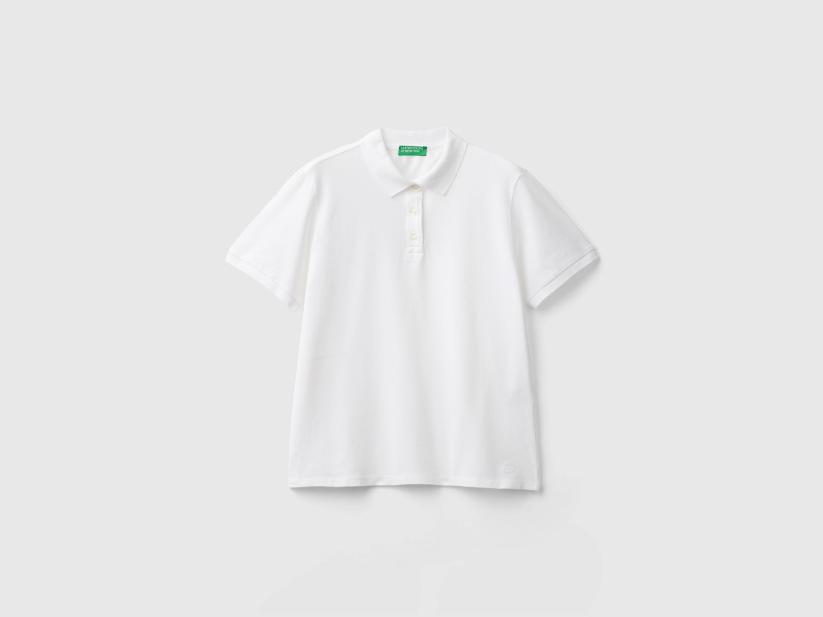 Polo in cotone bio stretch da donna bianco | Benetton Outlet