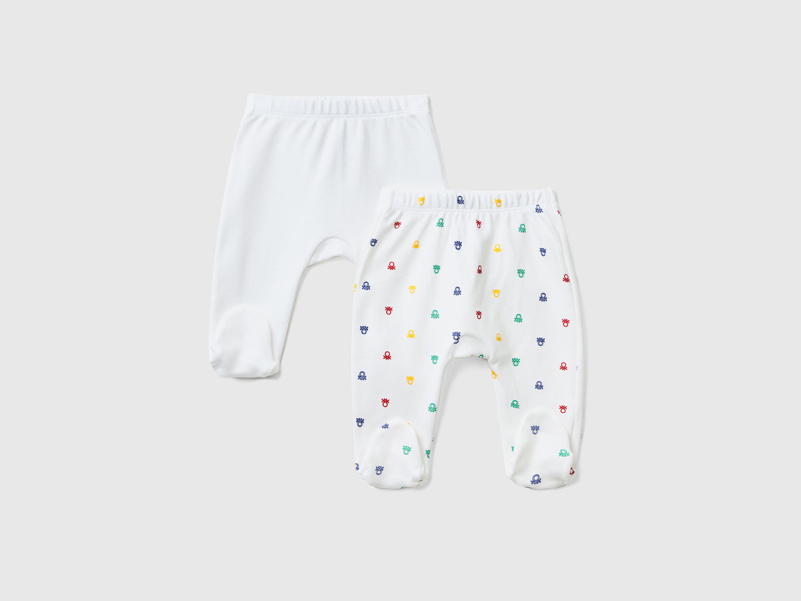 Set composto da due paia di pantaloncini con piedini in puro cotone da neonato multi-color | Benetton Outlet