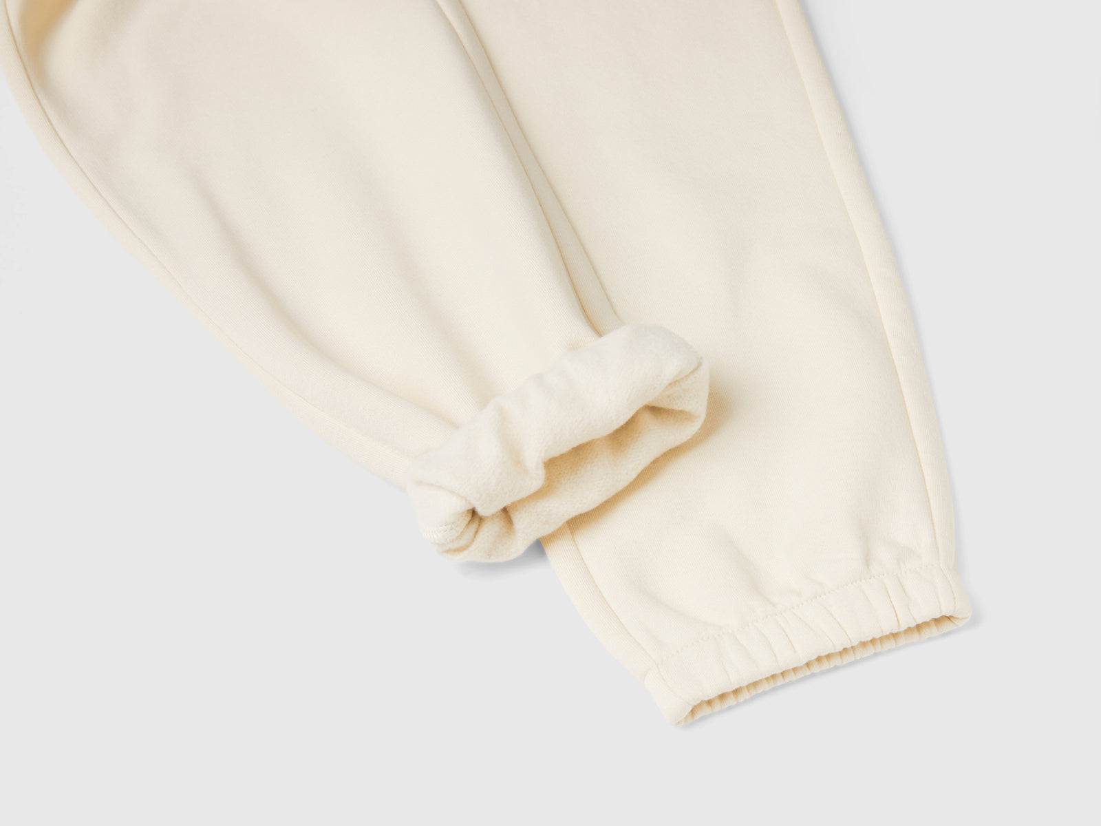 Joggers in felpa con coulisse da bambina bianco panna 3 | Benetton Outlet