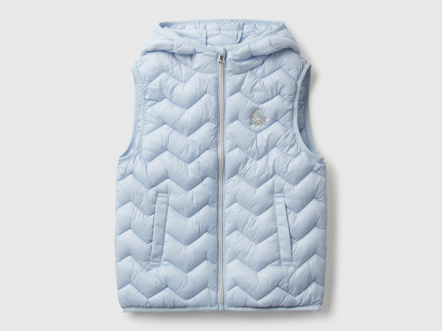 Gilet imbottito con cappuccio da bambina azzurro | Benetton Outlet