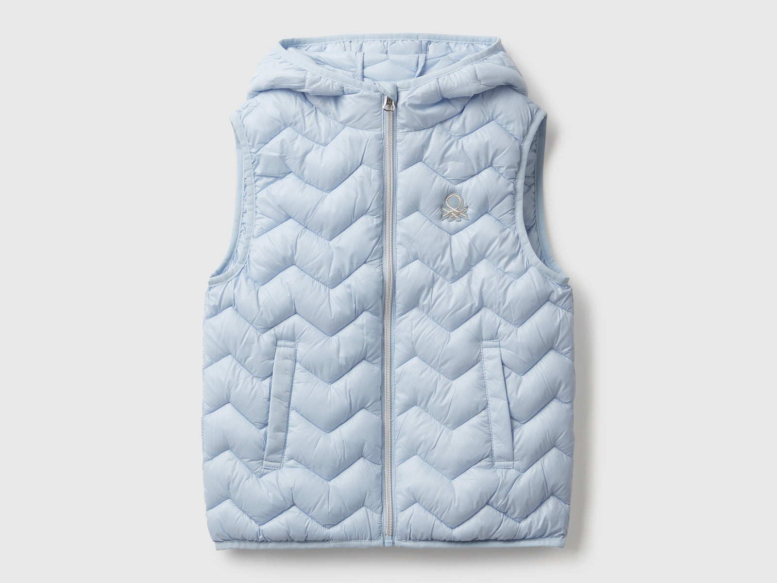 Gilet imbottito con cappuccio da bambina azzurro | Benetton Outlet