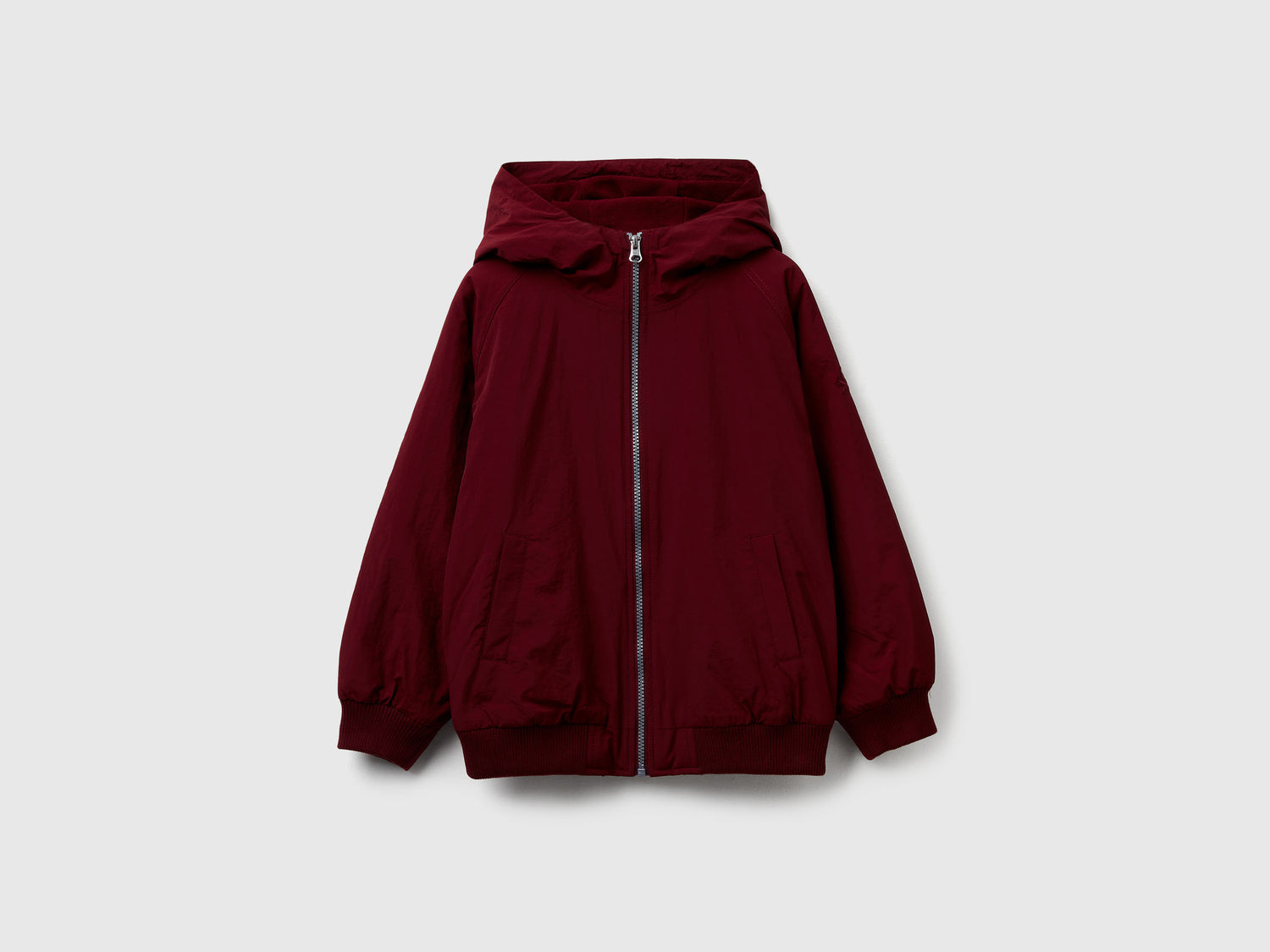 Giubbino in nylon con cappuccio da bambino bordeaux | Benetton Outlet