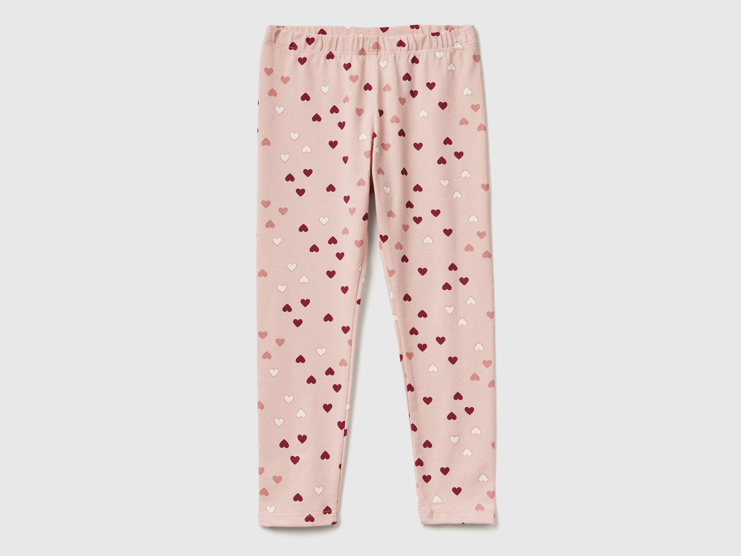 Leggings rosa chiaro a cuori da bimba rosa tenue | Benetton Outlet