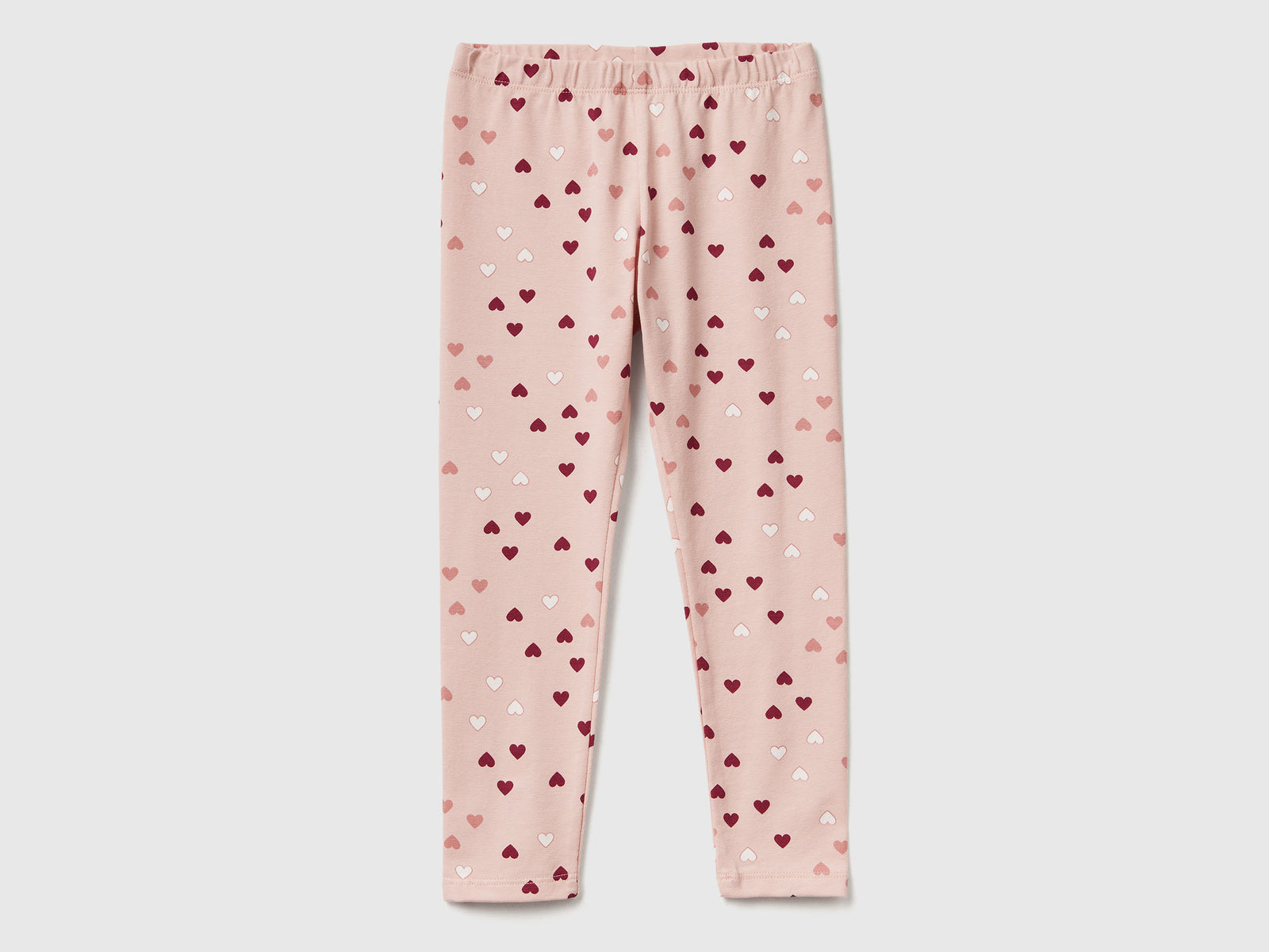 Leggings rosa chiaro a cuori da bimba rosa tenue | Benetton Outlet