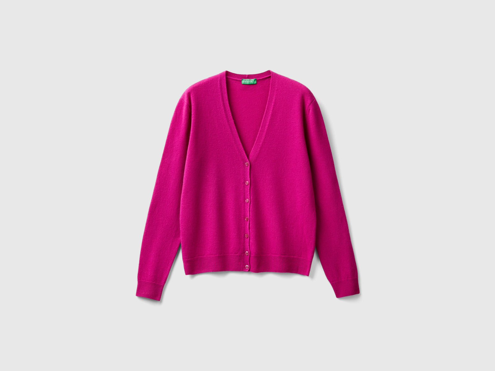 Cardigan scollo a V fucsia in pura lana Merino da donna ciclamino | Benetton Outlet