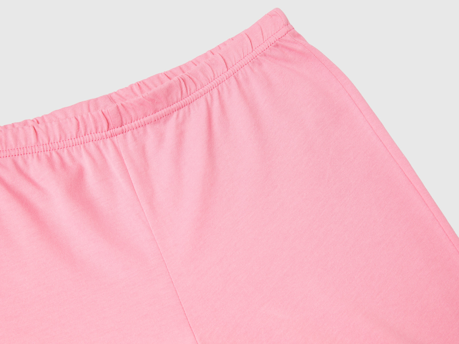 Pigiama lungo con logo glitter da bambino rosa 2 | Benetton Outlet