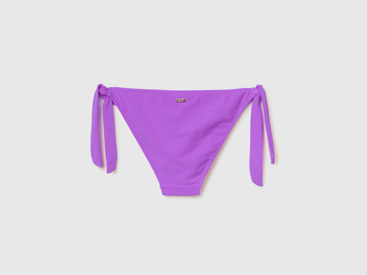 Slip mare con fiocchi sui fianchi in tessuto elasticizzato effetto spugna