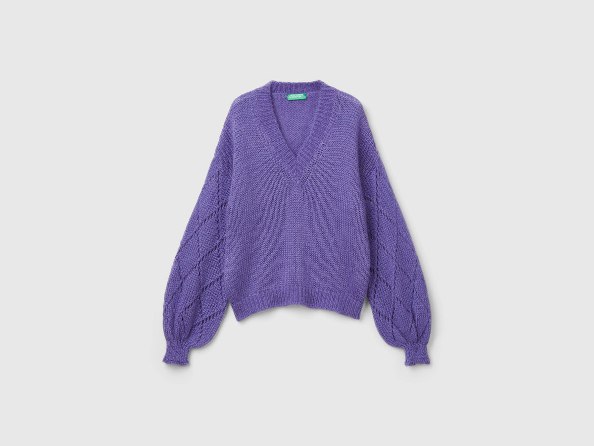Maglione con manica traforata
