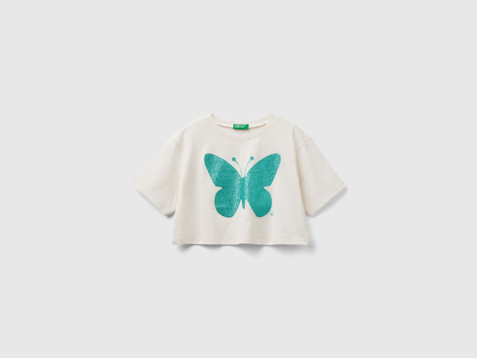 Maglietta con stampa glitter da bambina bianco panna | Benetton Outlet