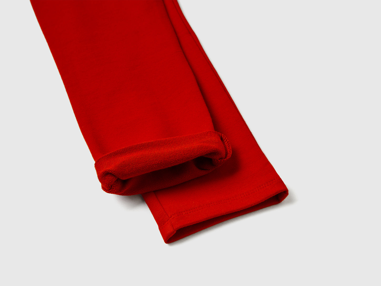 Leggings in felpa stretch da bambina rosso 2 | Benetton Outlet