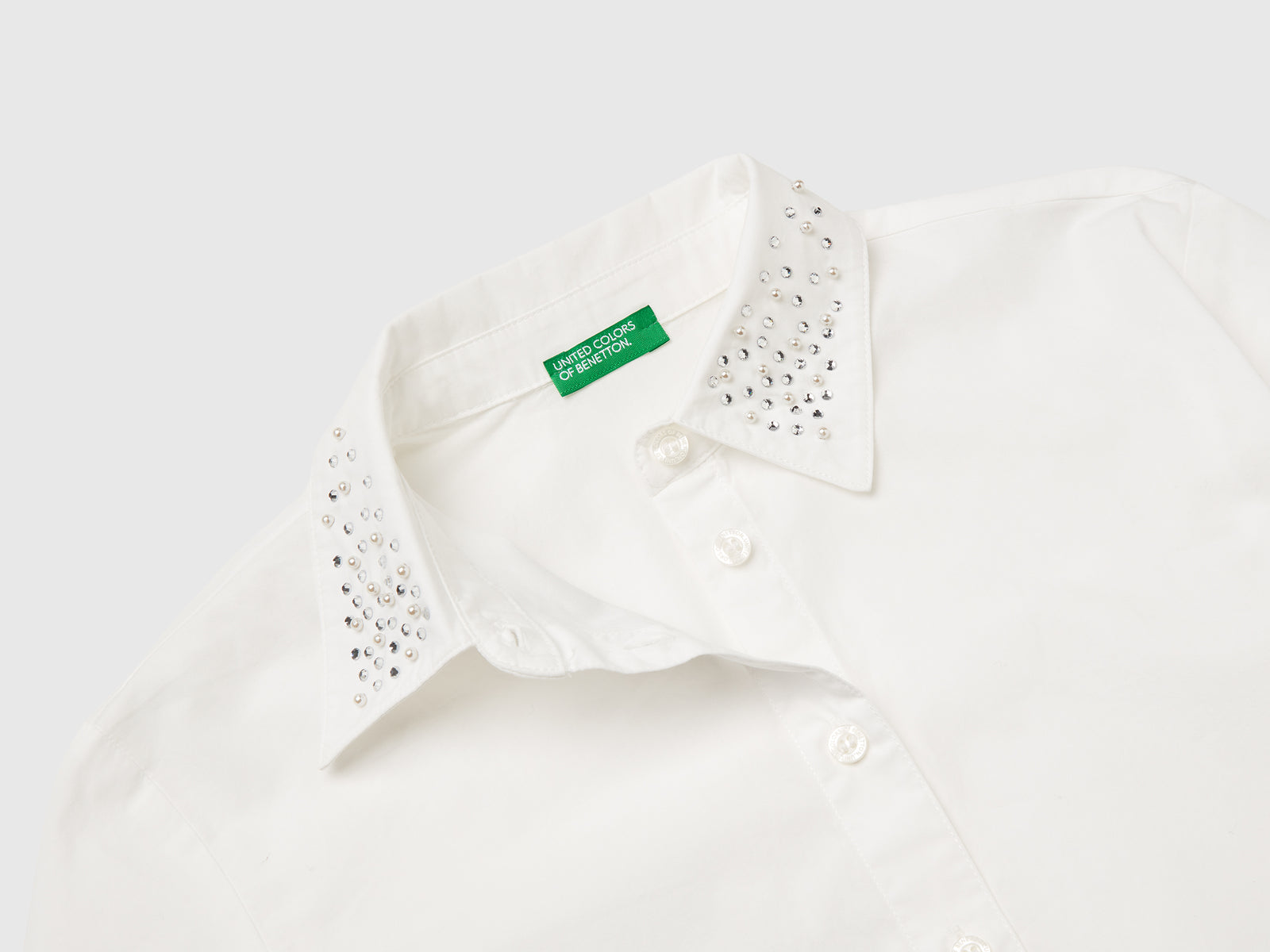 Camicia con applicazioni effetto gioiello da bambina bianco panna 3 | Benetton Outlet