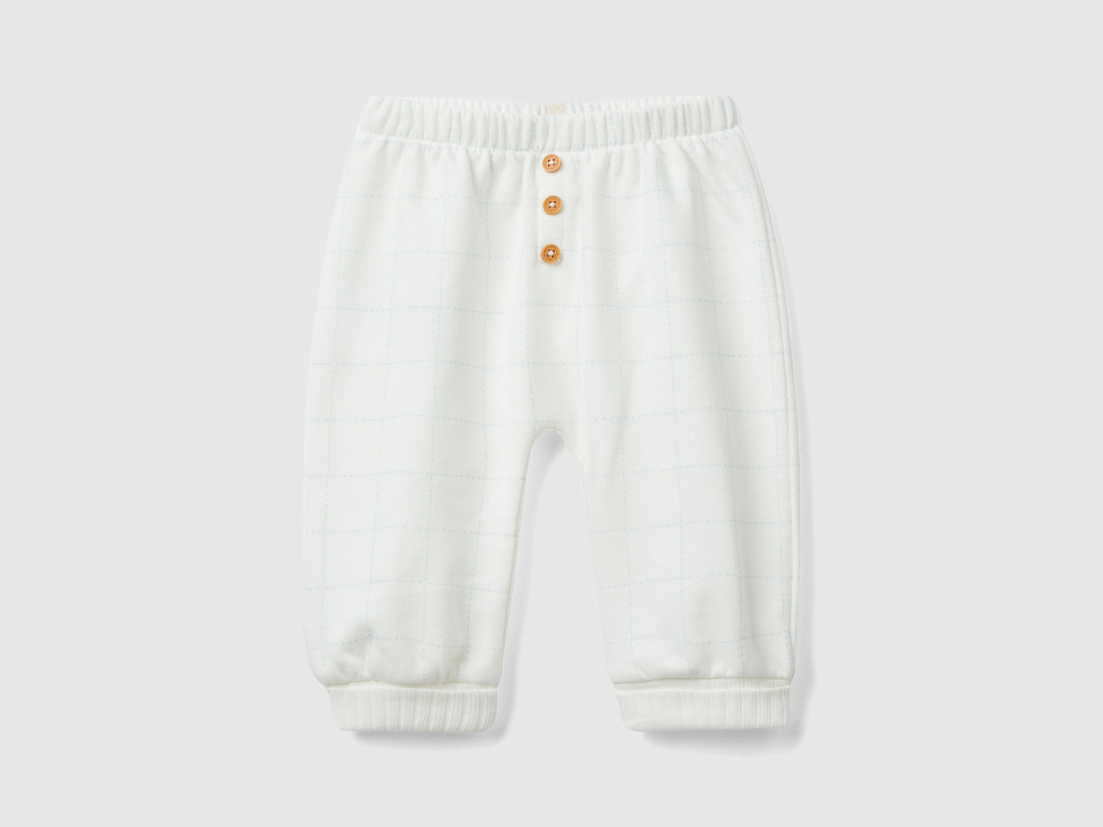 Pantaloni in felpa con bottoni da neonato bianco panna | Benetton Outlet