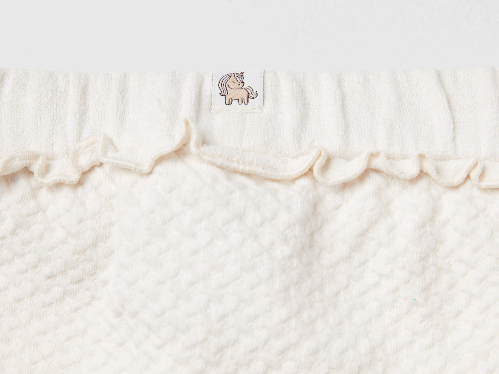 Pantaloni jacquard con spacchetti da neonato bianco panna 2 | Benetton Outlet